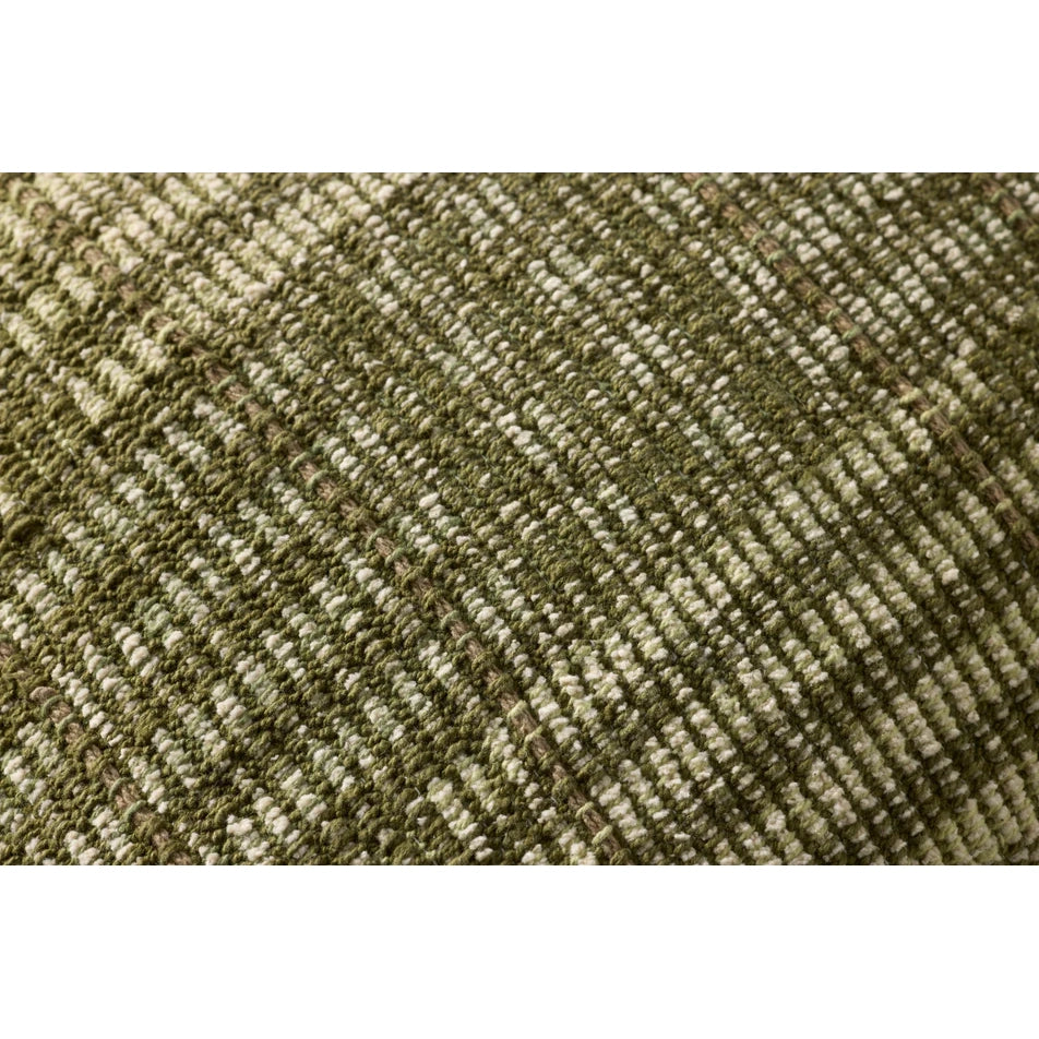 Close-up of a textured green fabric with a subtle pattern