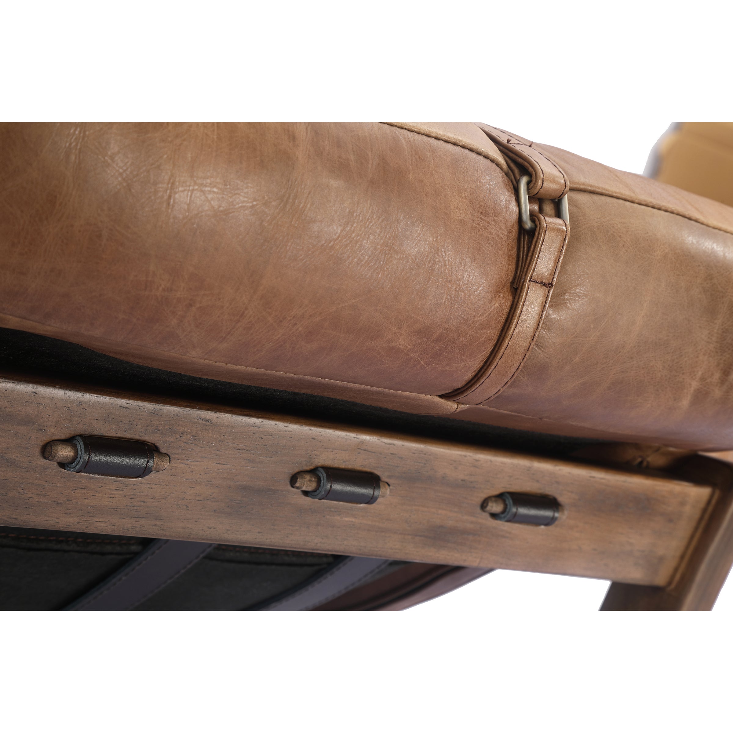 Close-up of a brown leather chair with metal accents on a white background