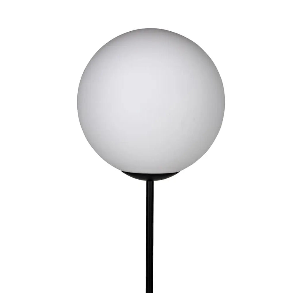 A modern minimalist floor lamp featuring a large, matte white spherical globe shade on a slim black metal stand, isolated on a white background.