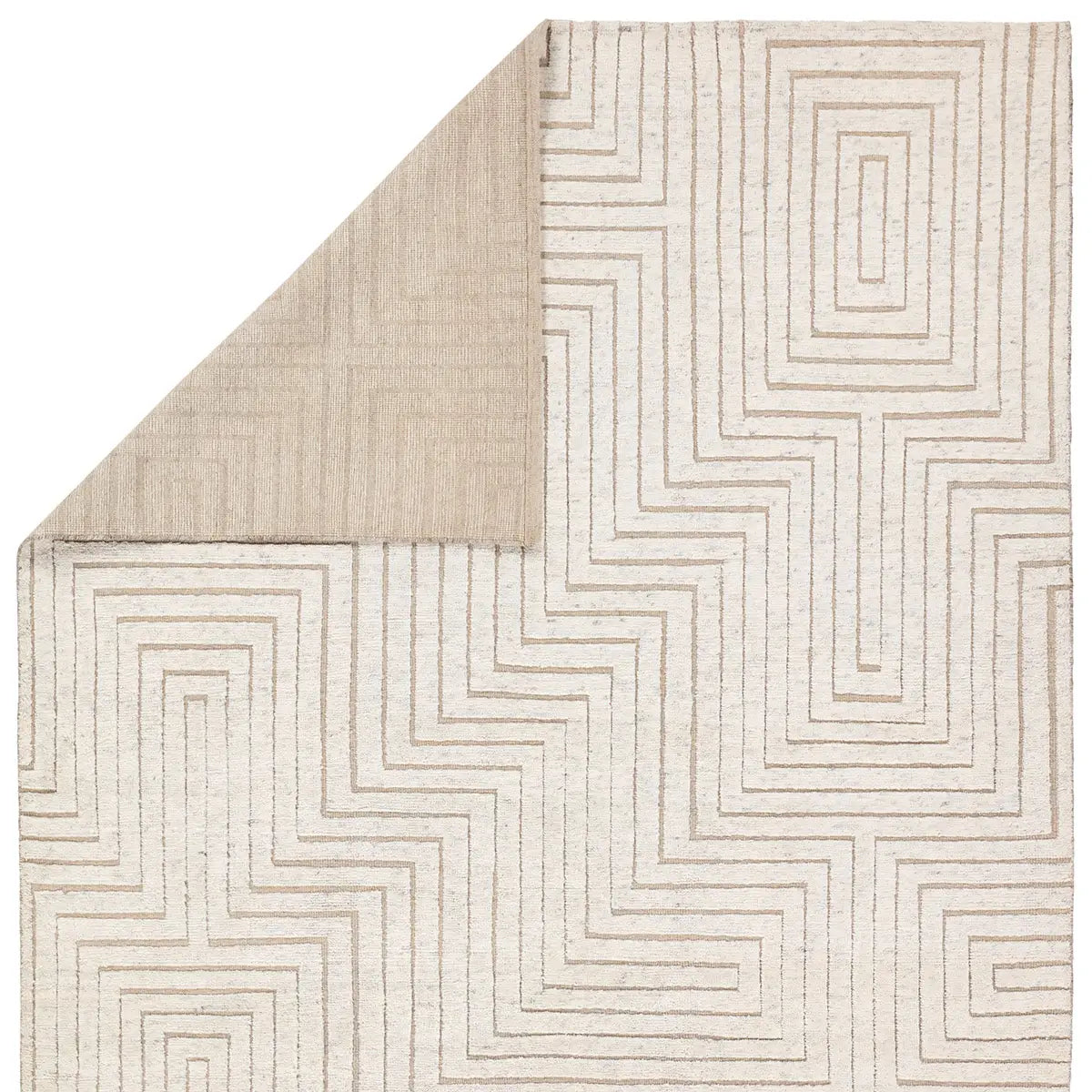 Close-up of a textured rug with geometric pattern on a white background