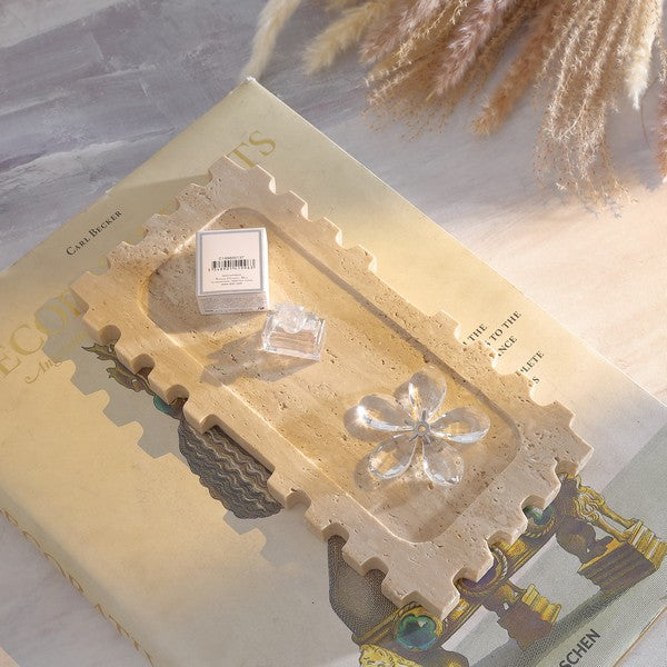 Decorative book with clear crystal-like objects on a textured surface