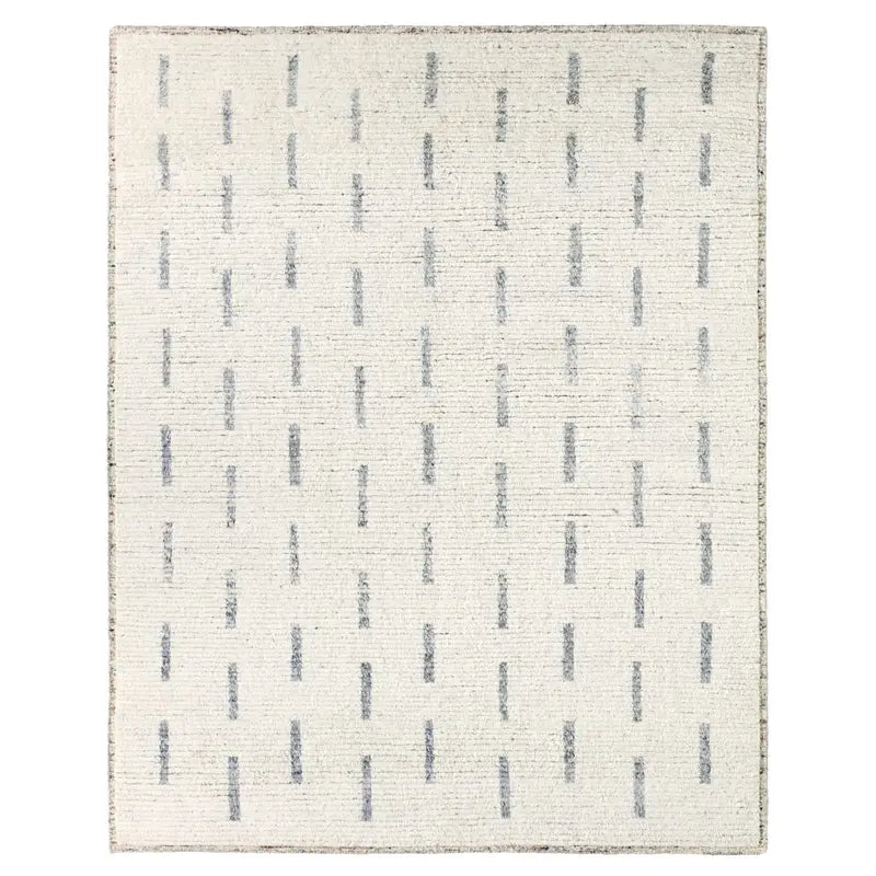 Textured area rug with a subtle pattern on a white background