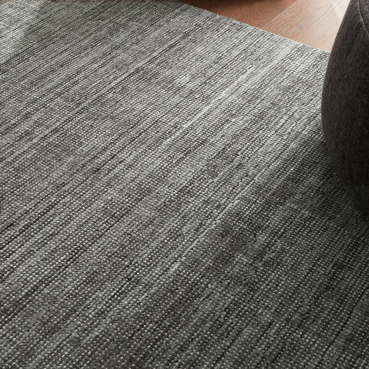 Close-up of a grey textured rug in room