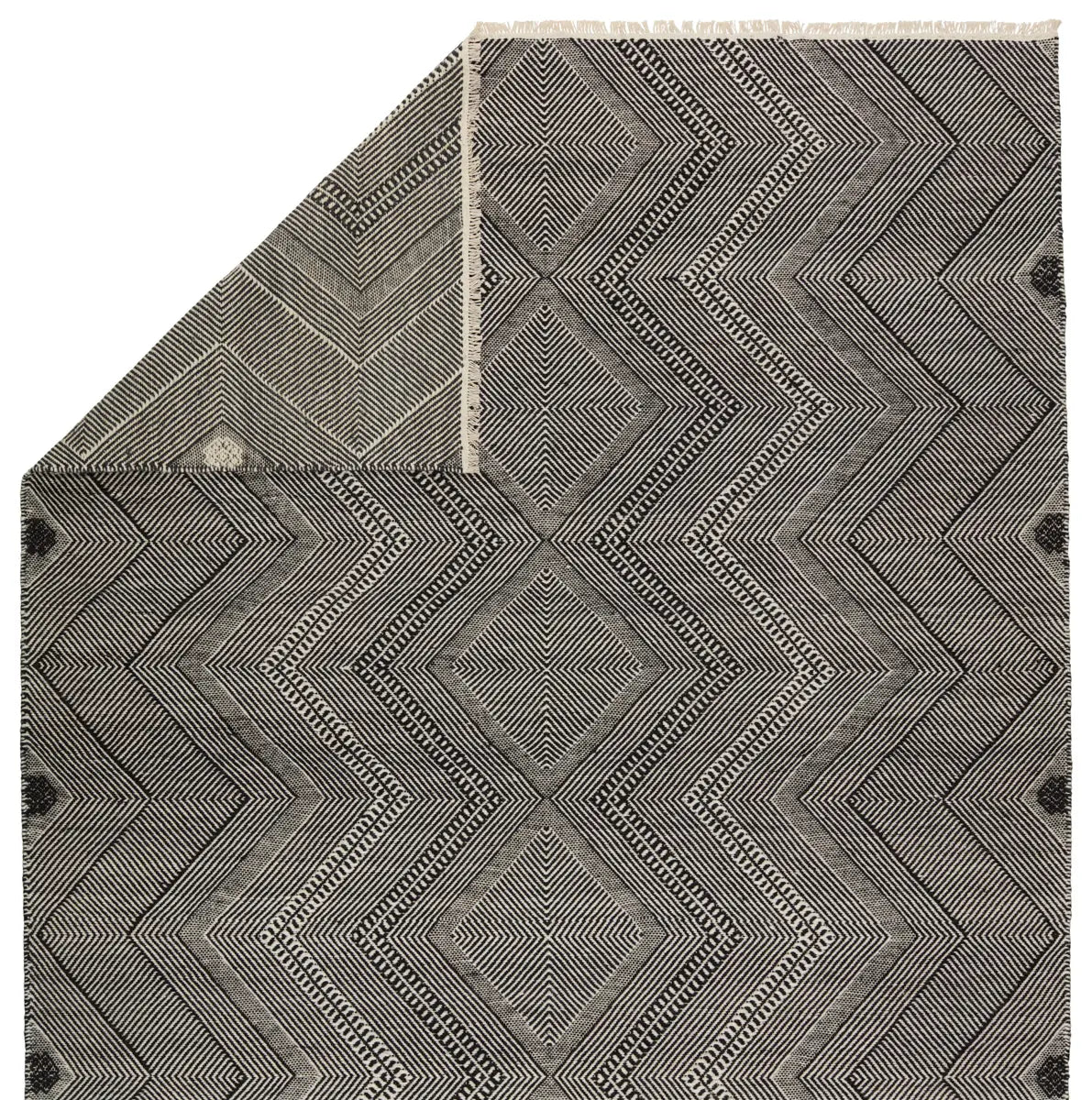 Gray geometric patterned rug with black accents