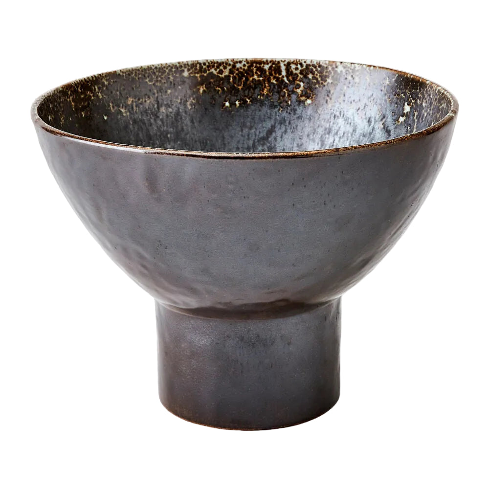 Ceramic bowl with a textured surface on a white background