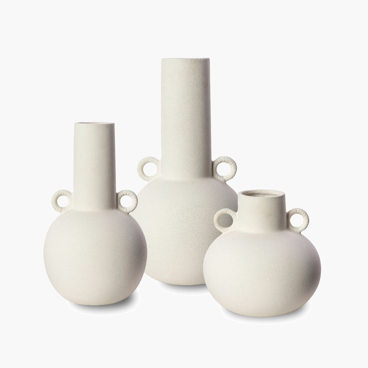 Three white vases of different shapes and sizes on a white background
