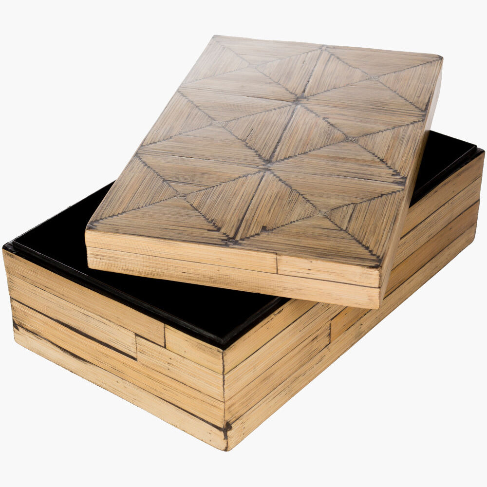 Wooden box with geometric patterned lid on a white background