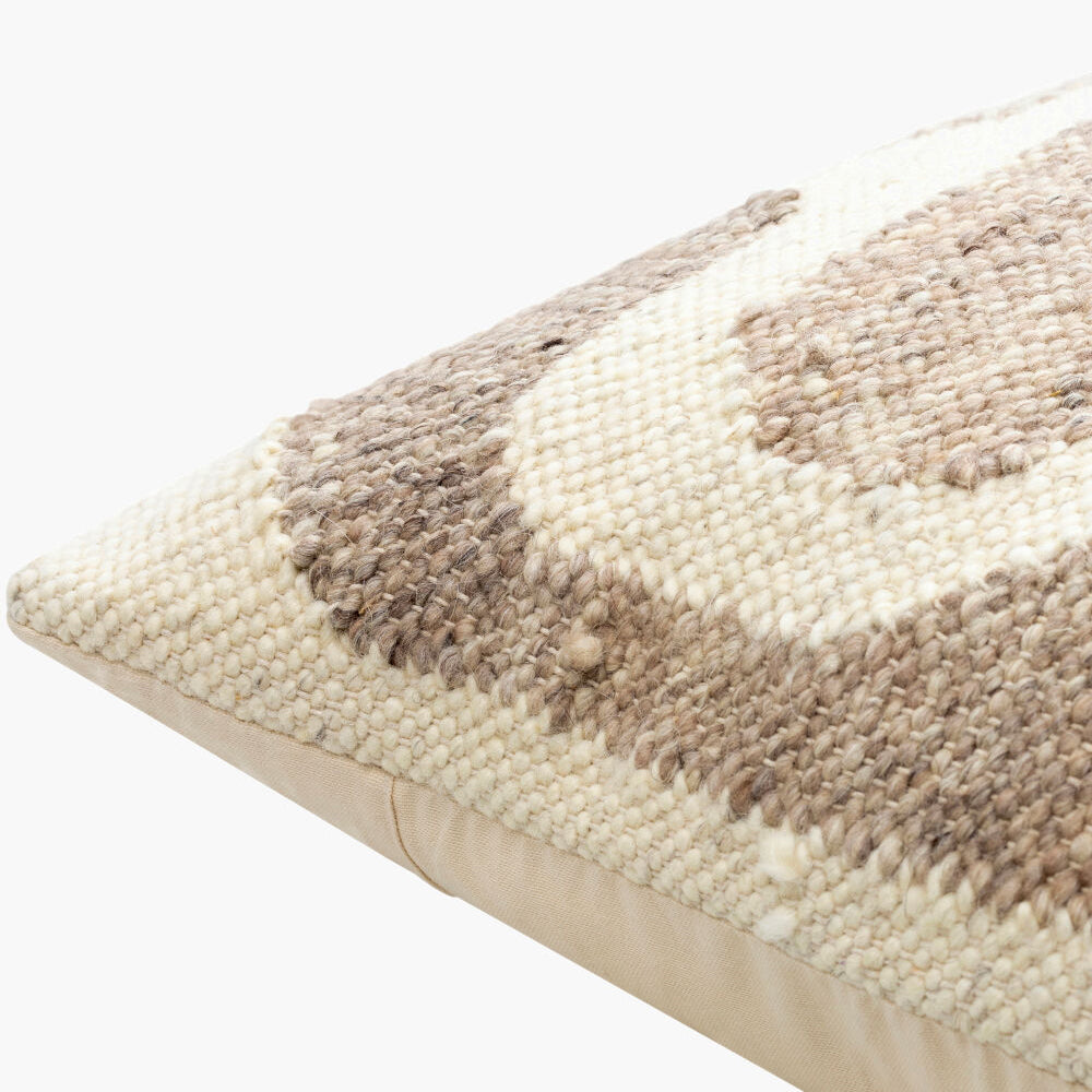 Textured pillow with a checkered pattern on a white background