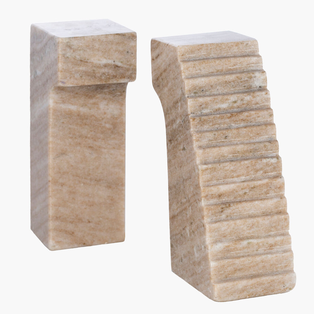 Two stone-like bookends on a white background