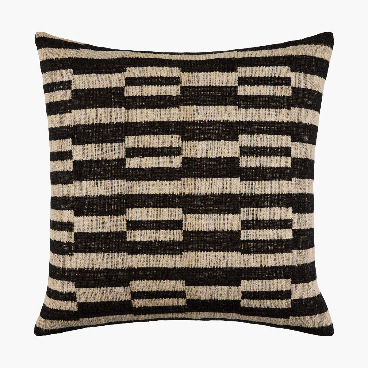 Decorative pillow with black and beige geometric pattern on a white background