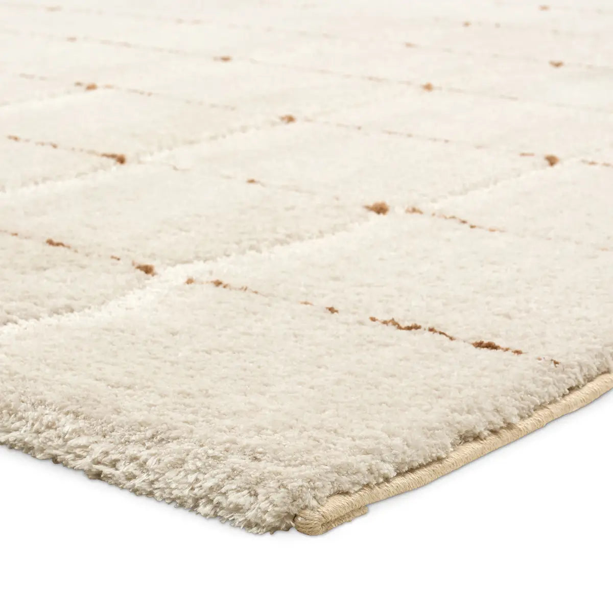 Beige shaggy rug corner on a white background