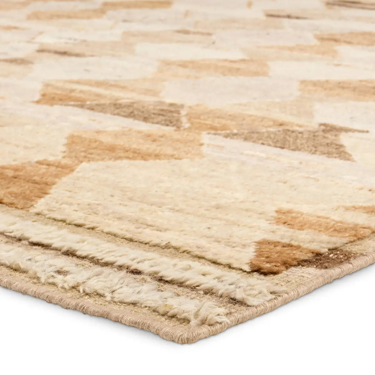 Beige and brown patterned rug on a white background
