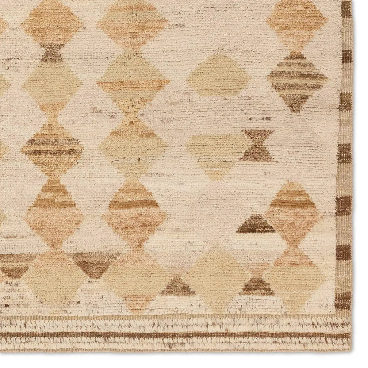 Beige and brown geometric patterned rug with a textured finish
