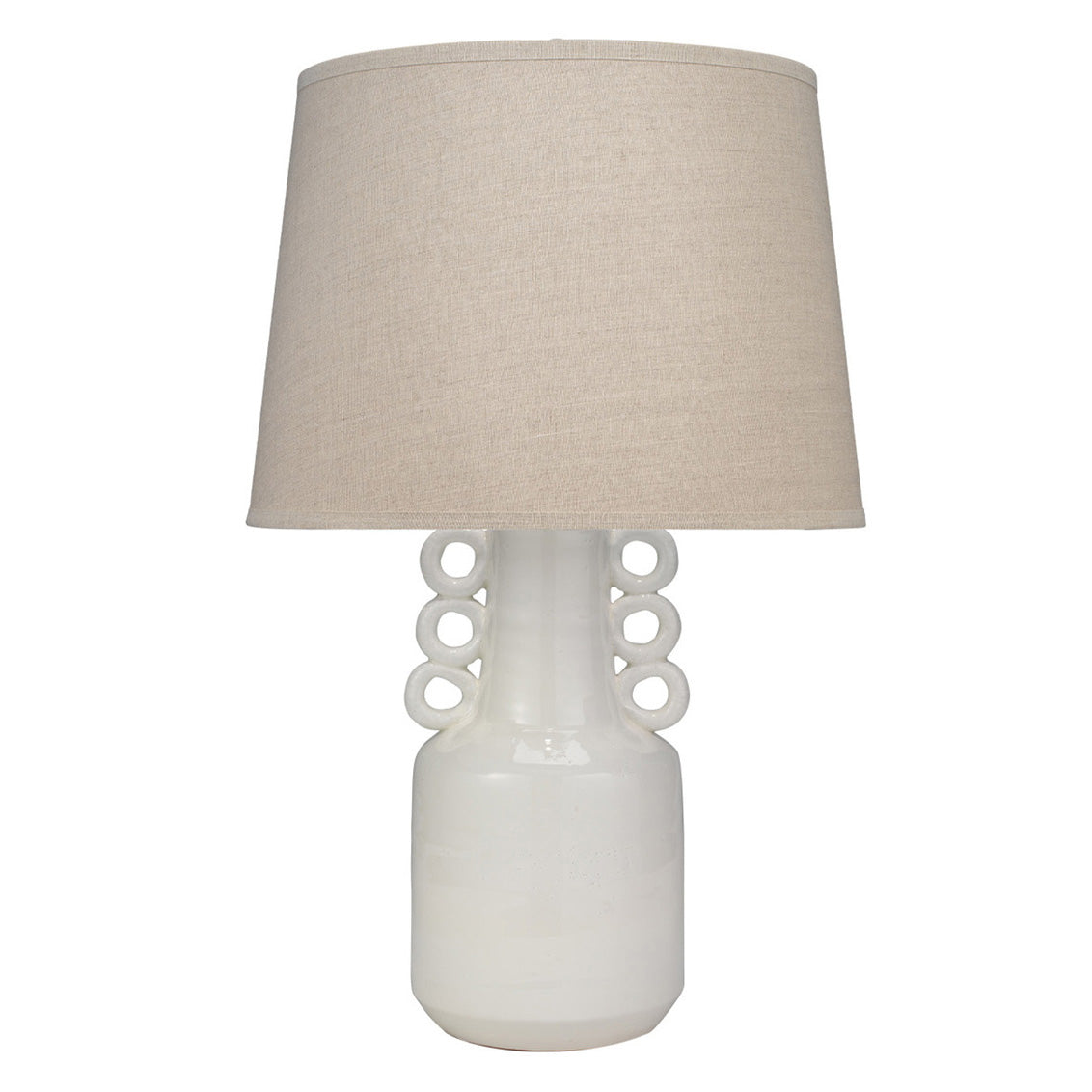 Table lamp with a white base with decorative rings and beige lampshade on a white background
