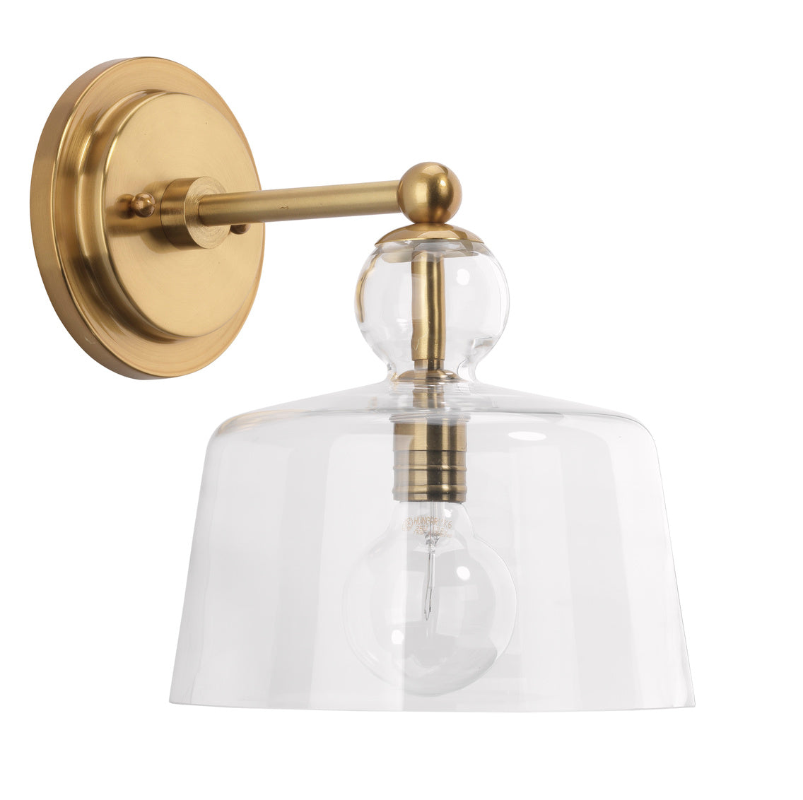 Gold wall sconce with clear glass shade on a white background