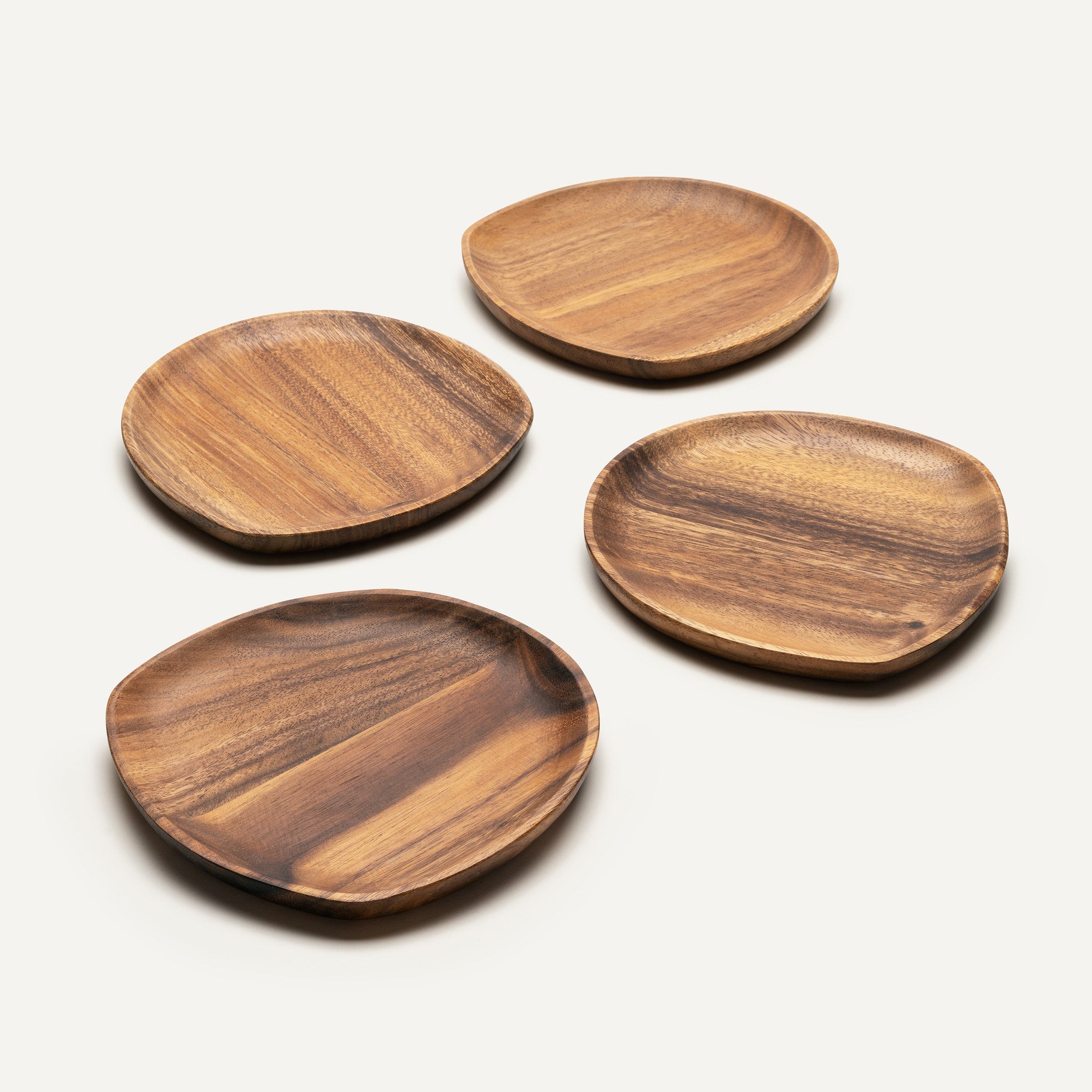 Four wooden plates on a white background