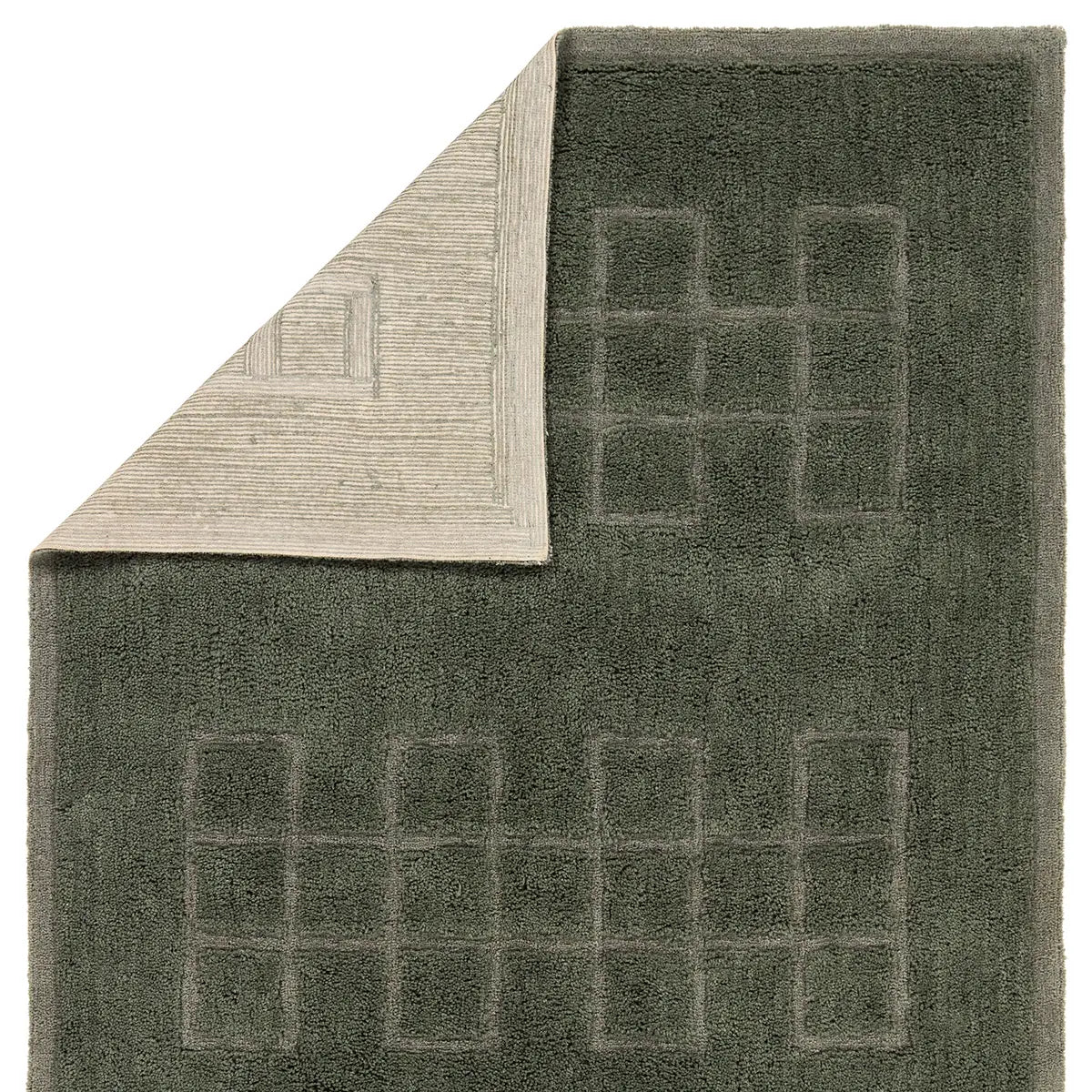 Textured green rug with geometric pattern on a white background