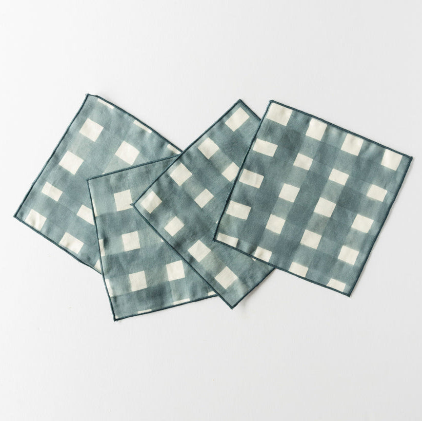 linen napkins set in blue plaid finish on white background