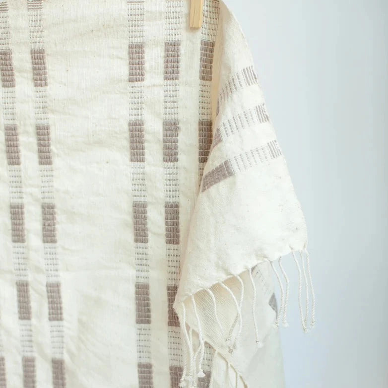 Textured towel with a checkered pattern on a light gray background