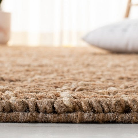 Close-up of a textured brown rug with a blurred background