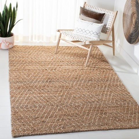 Woven jute rug in a room with a chair and plant