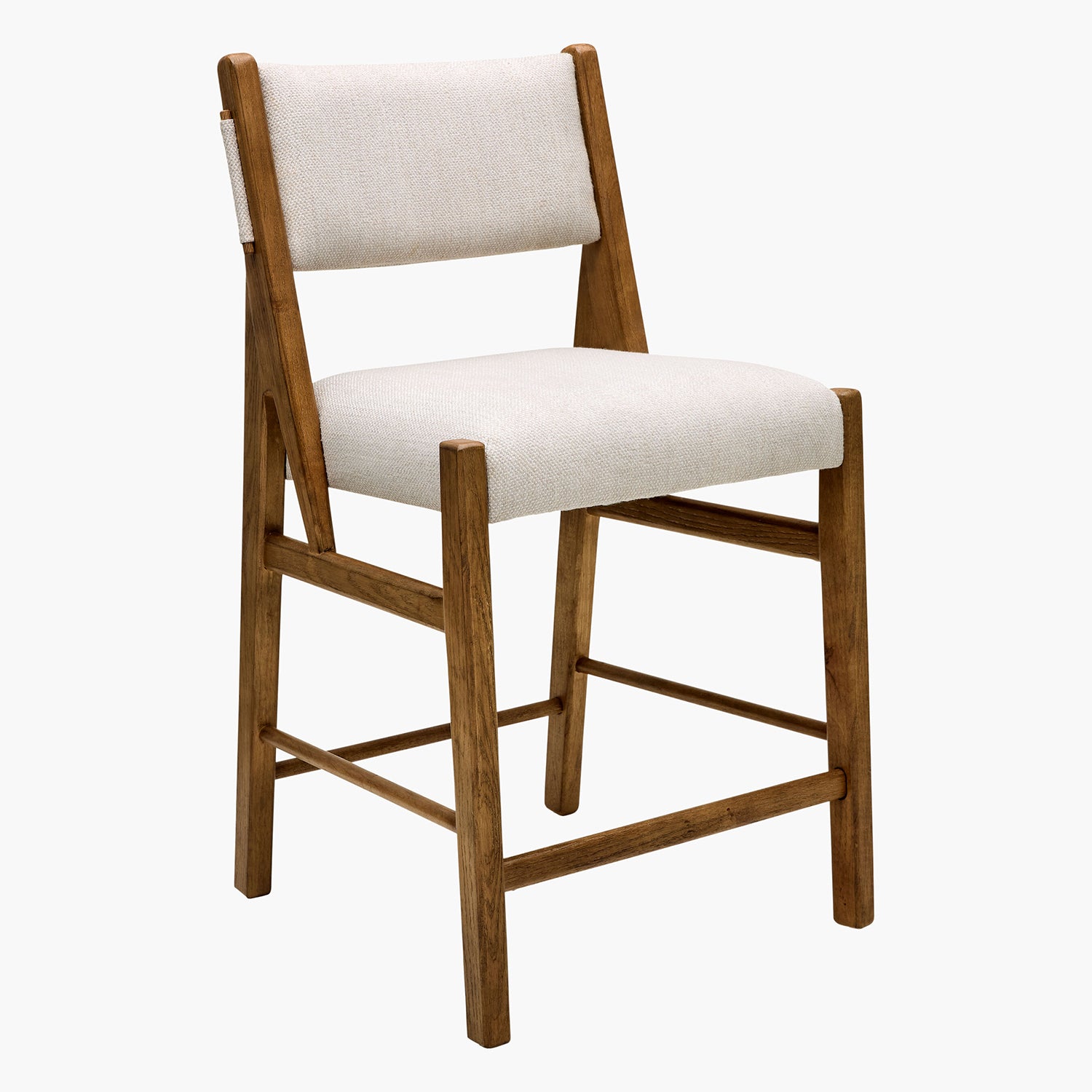 Wooden chair with white cushioned seat and backrest on a white background