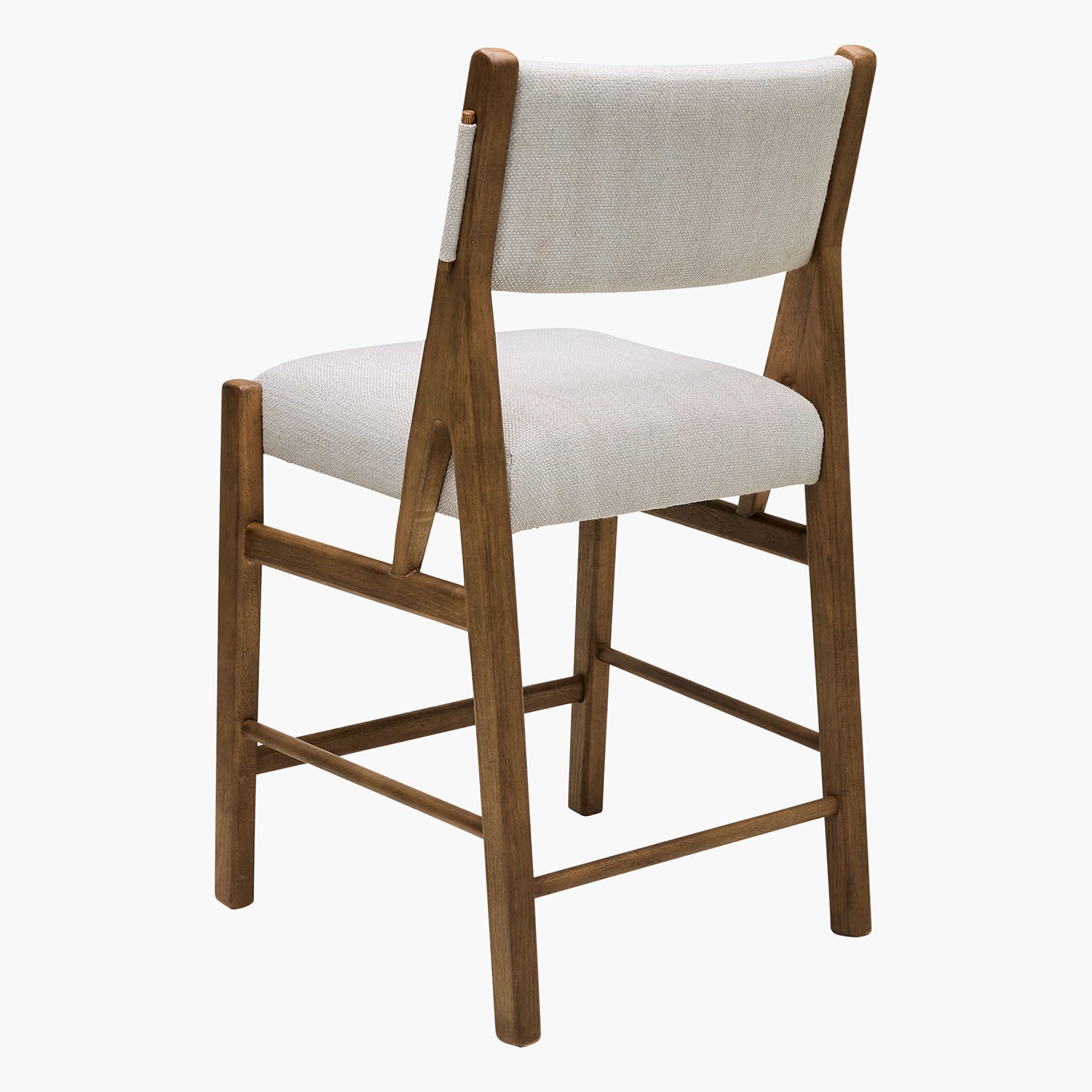 Wooden bar stool with white cushioned seat and backrest on a white background