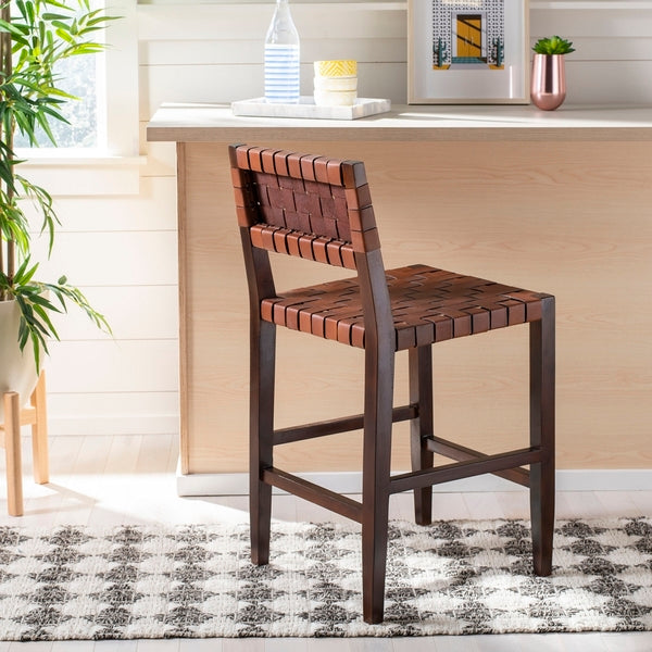 Wooden bar stool with woven backrest in a home setting