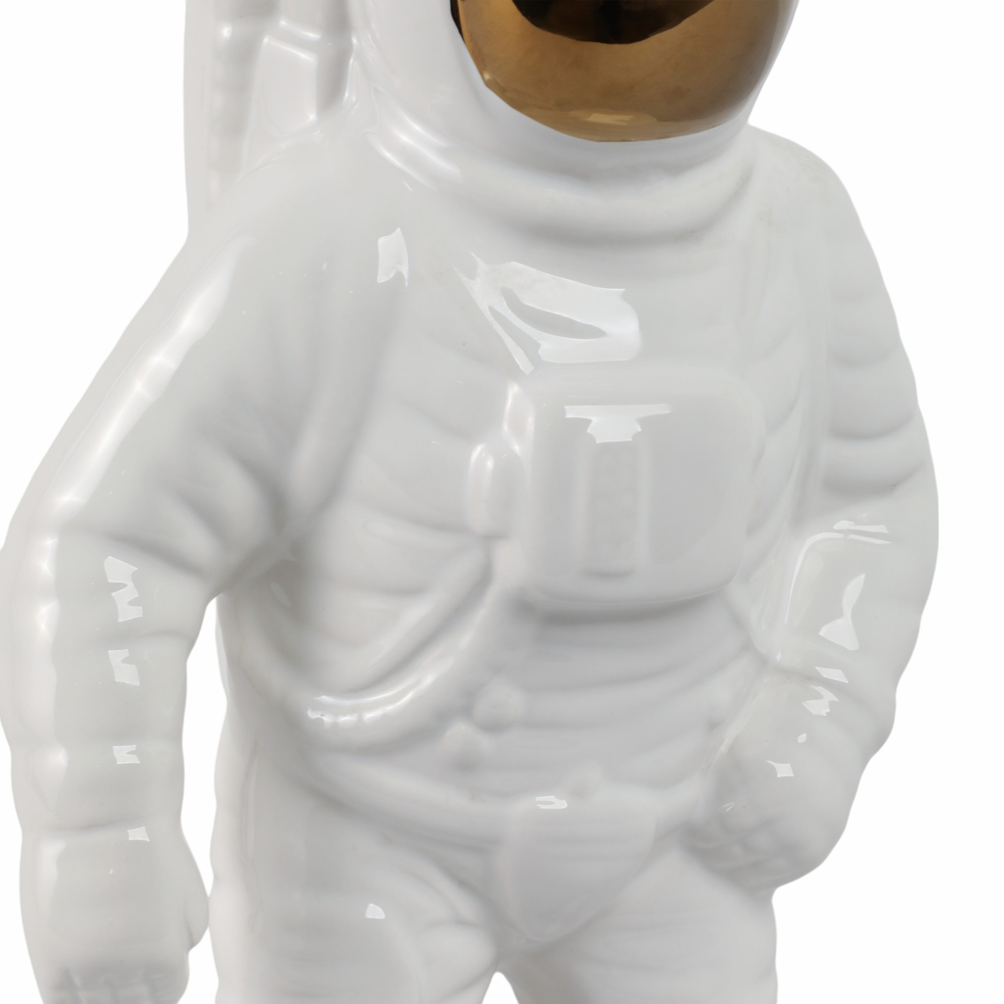 White ceramic astronaut figure on a white background