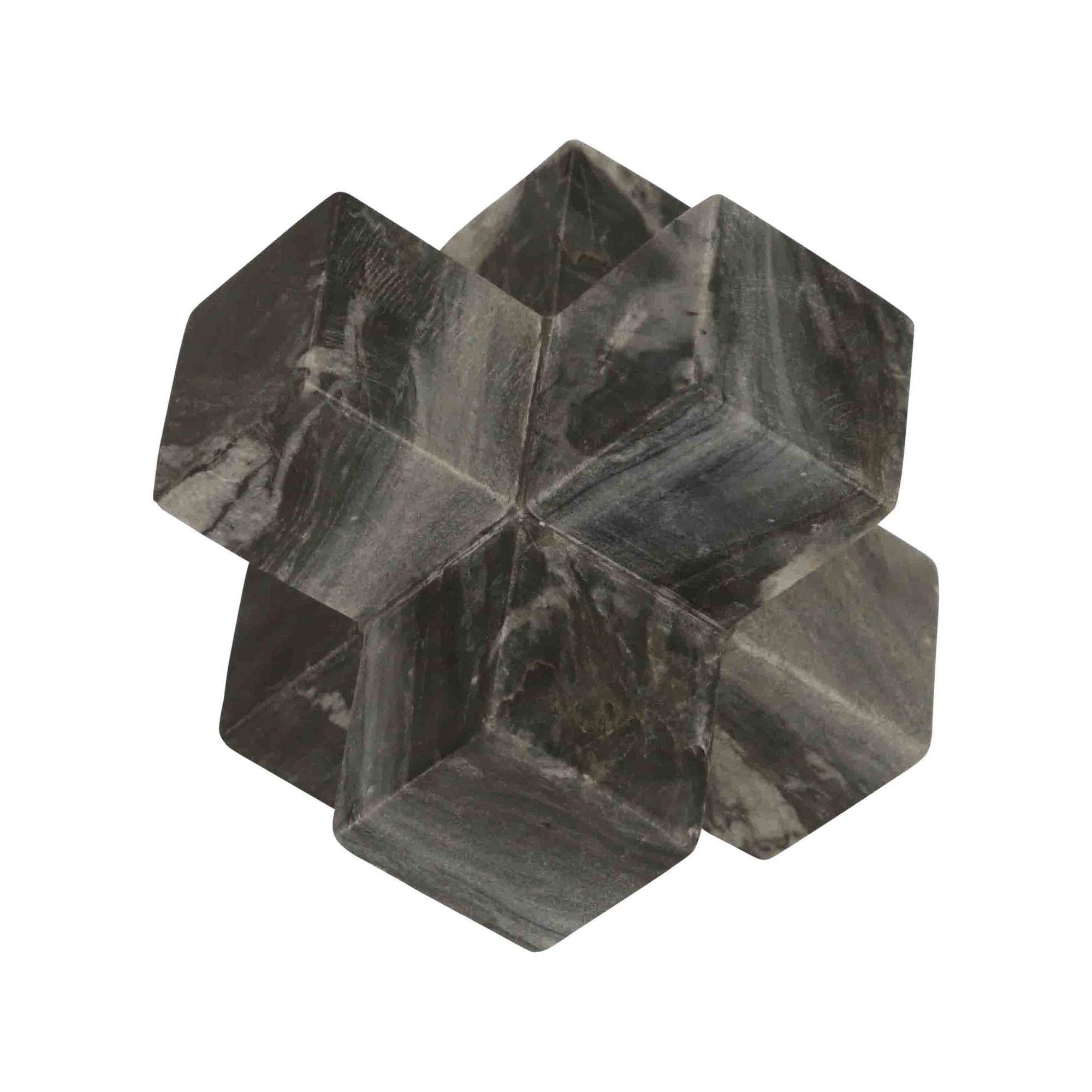 Geometric stone sculpture on a white background