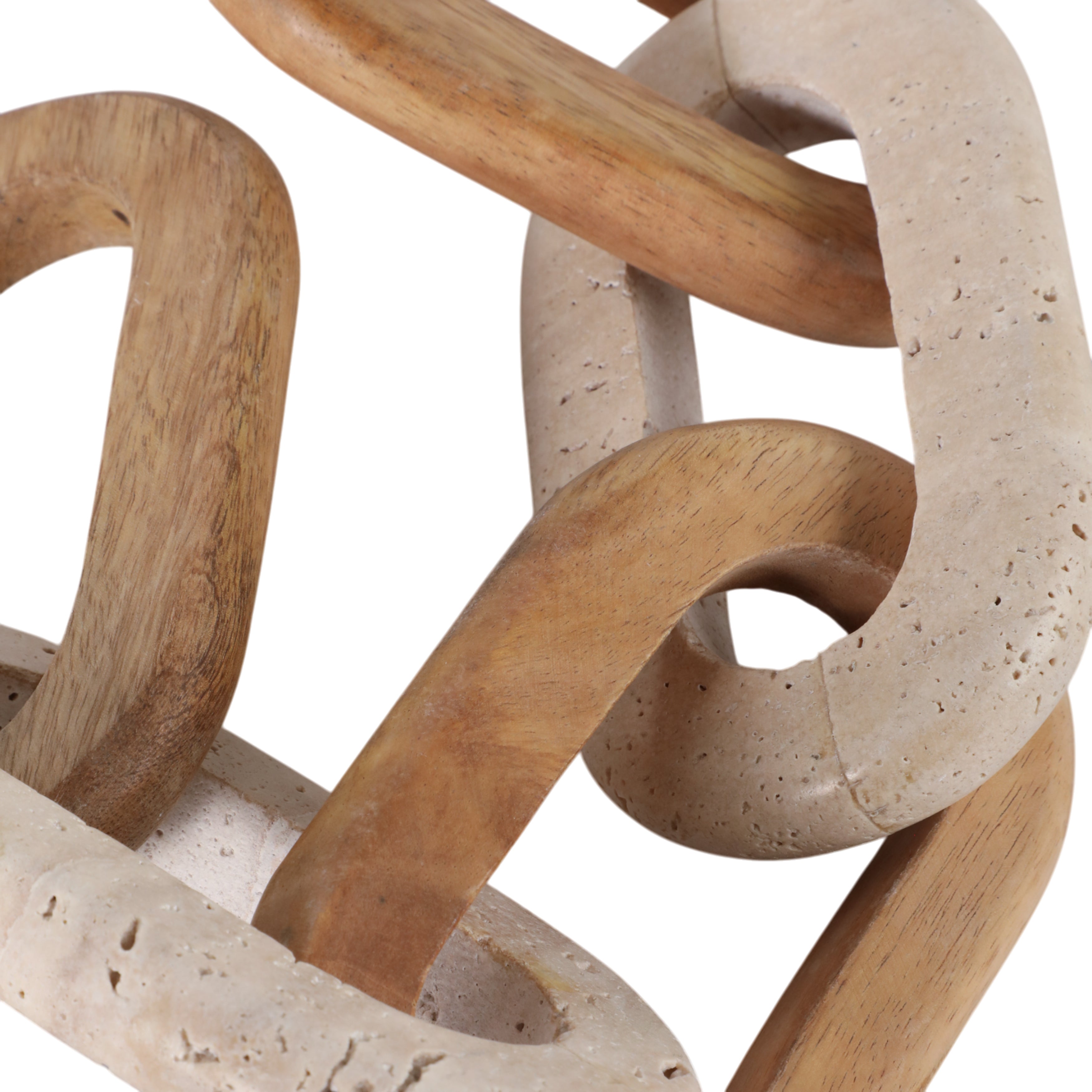 Close-up of a wooden and stone sculpture with intertwined loops on a white background