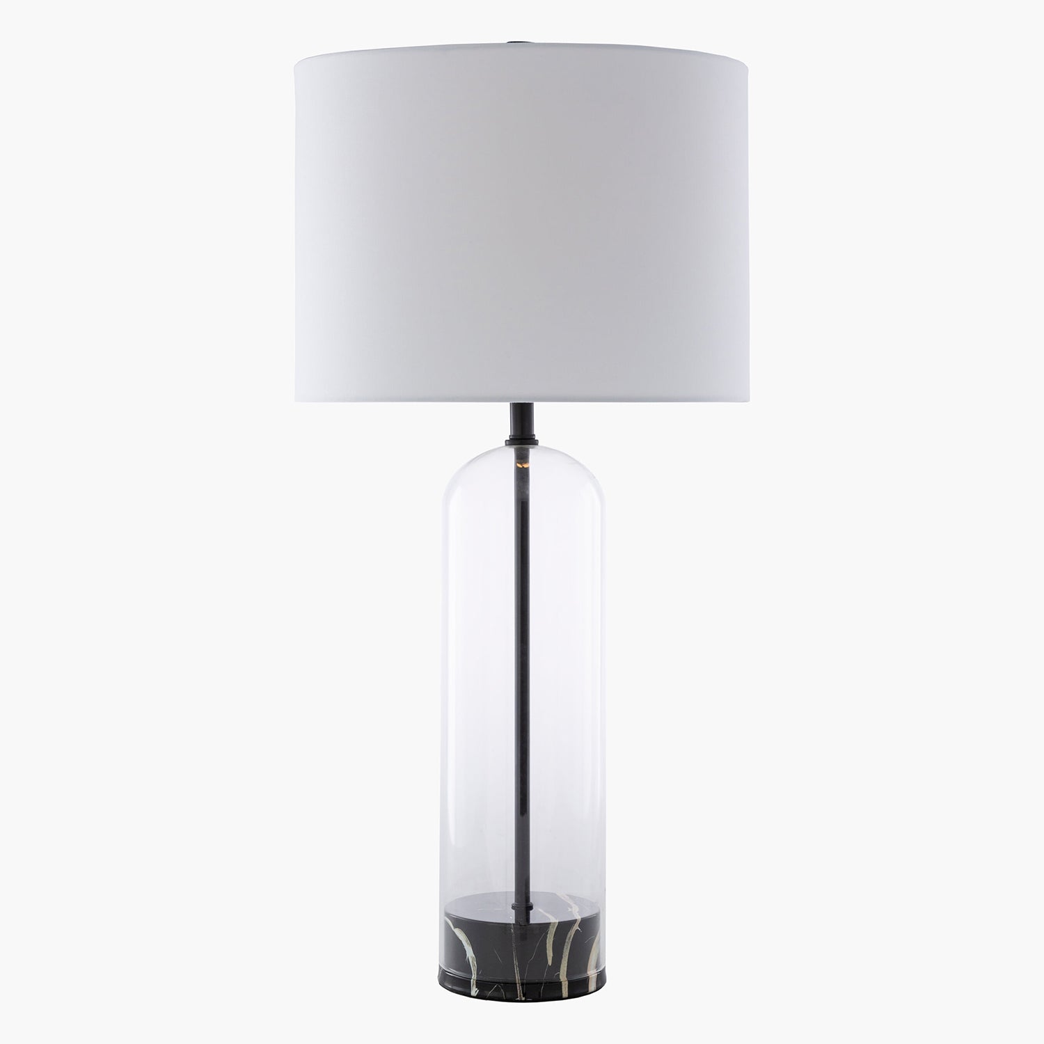 Table lamp with a white shade and clear cylindrical base on a white background