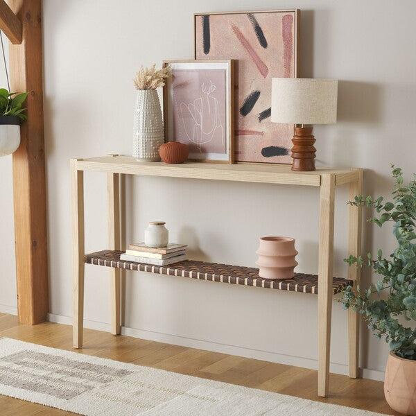 Wooden console table with decorative items against a white wall