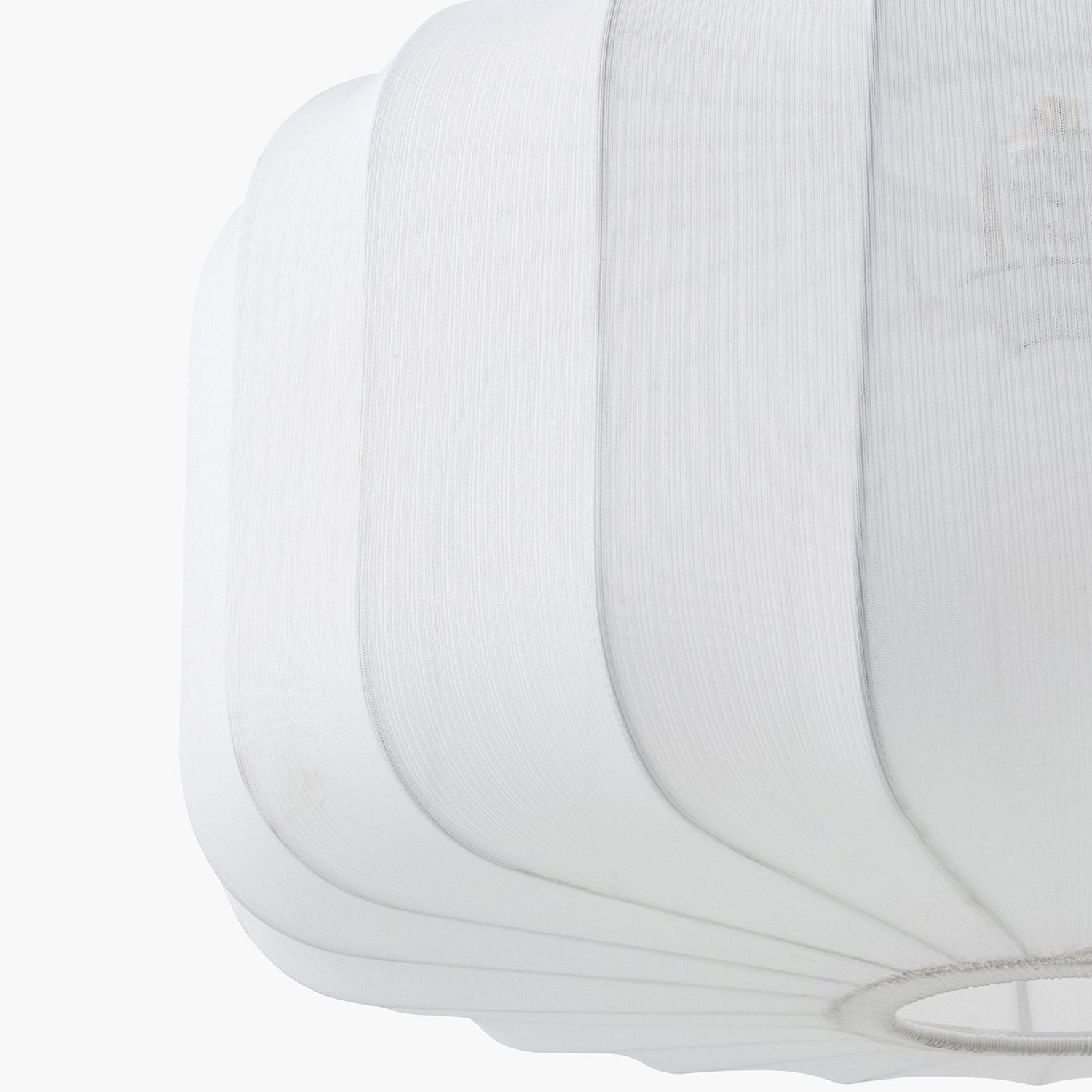 Close-up of a white cotton pendant light on a white background