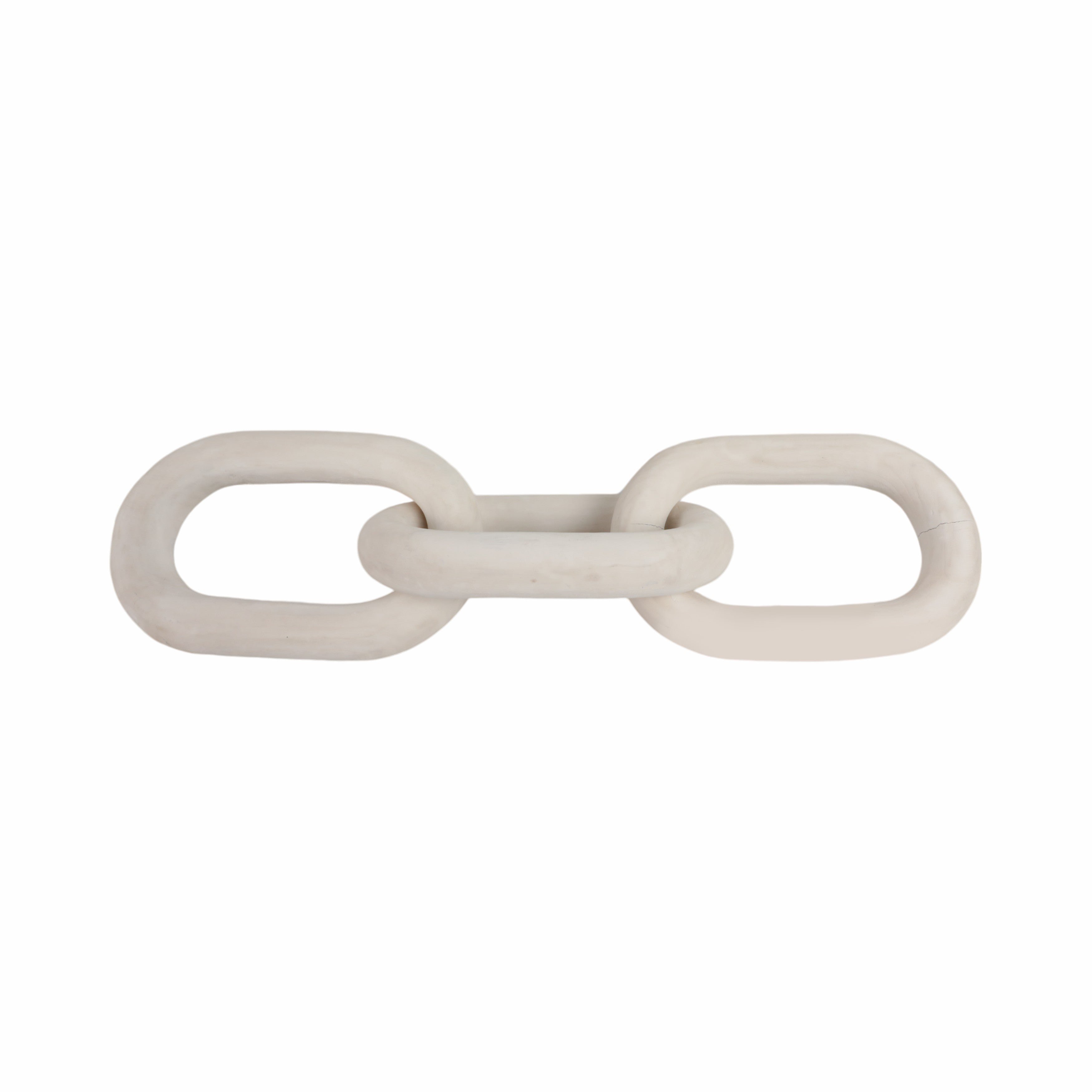 White ceramic chain-like object on a white background