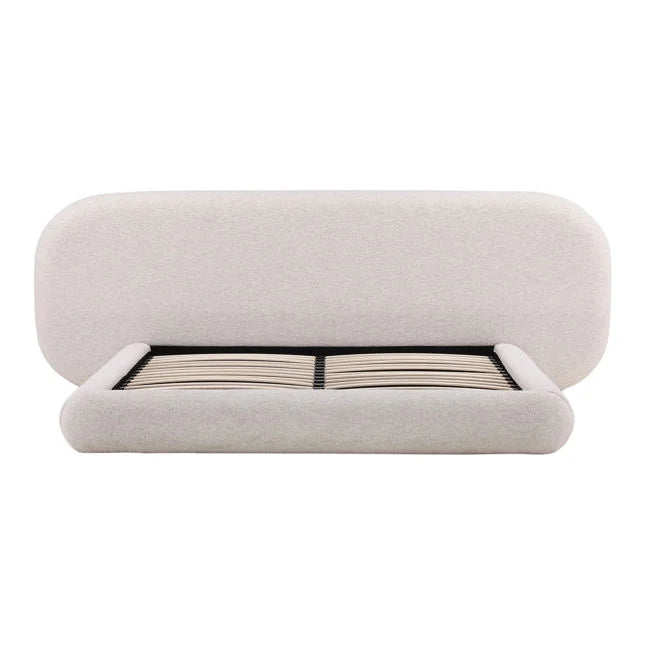 Beige upholstered bed frame on a white background