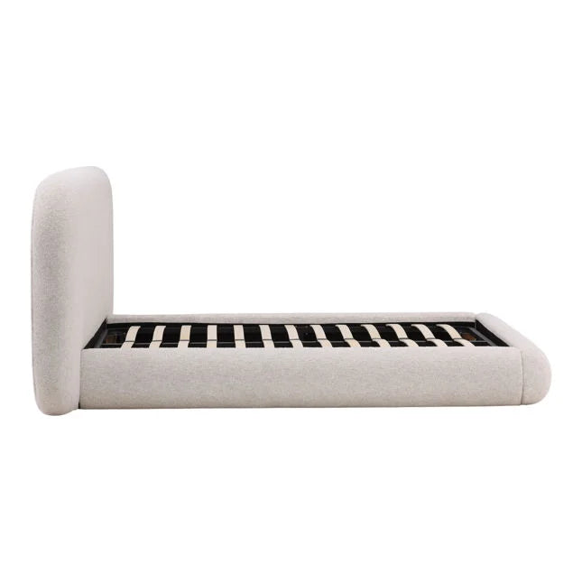 Beige upholstered bed frame on a white background