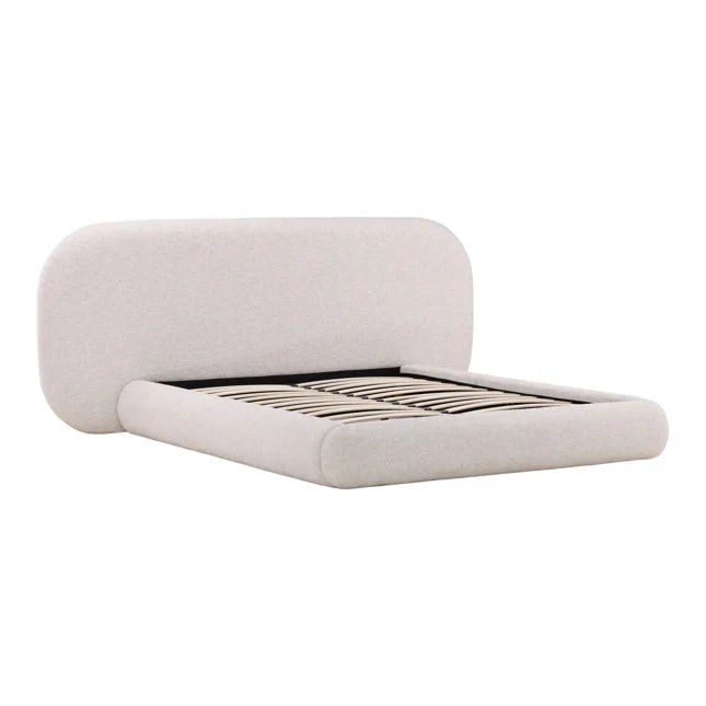 Light upholstered bed frame on a white background
