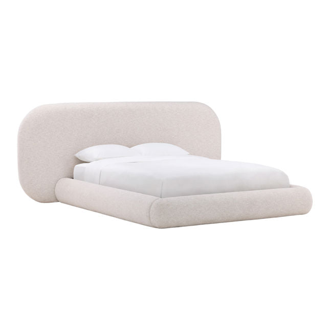 Modern bed with beige upholstered headboard and white bedding on a white background