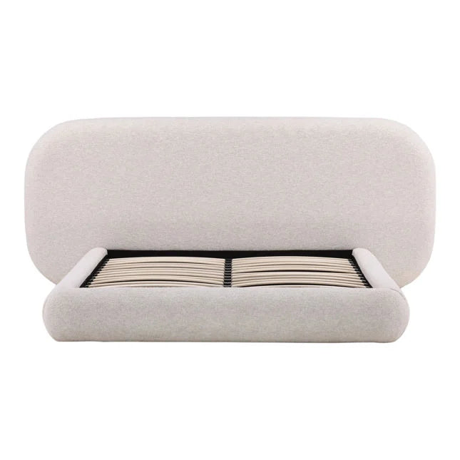 Beige upholstered bed frame on a white background