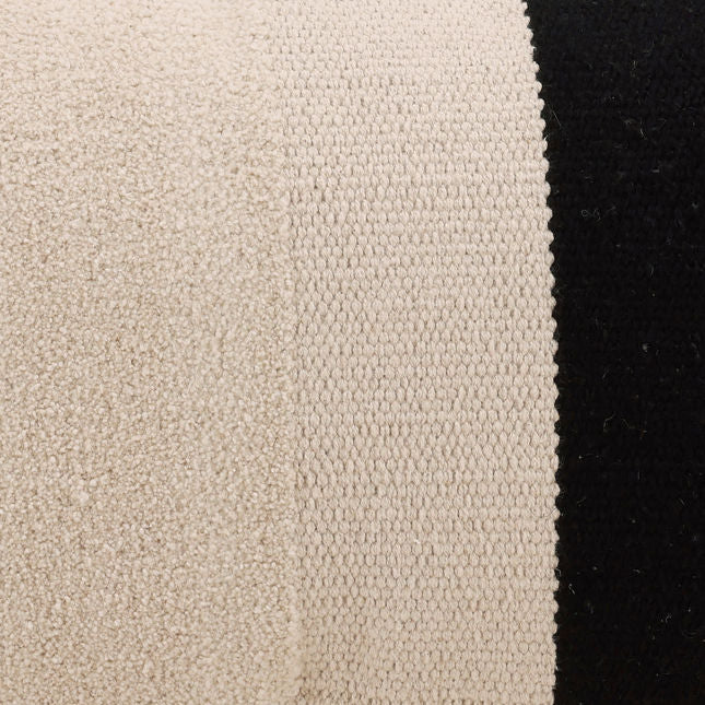 Close-up of beige fabric texture next to black fabric texture