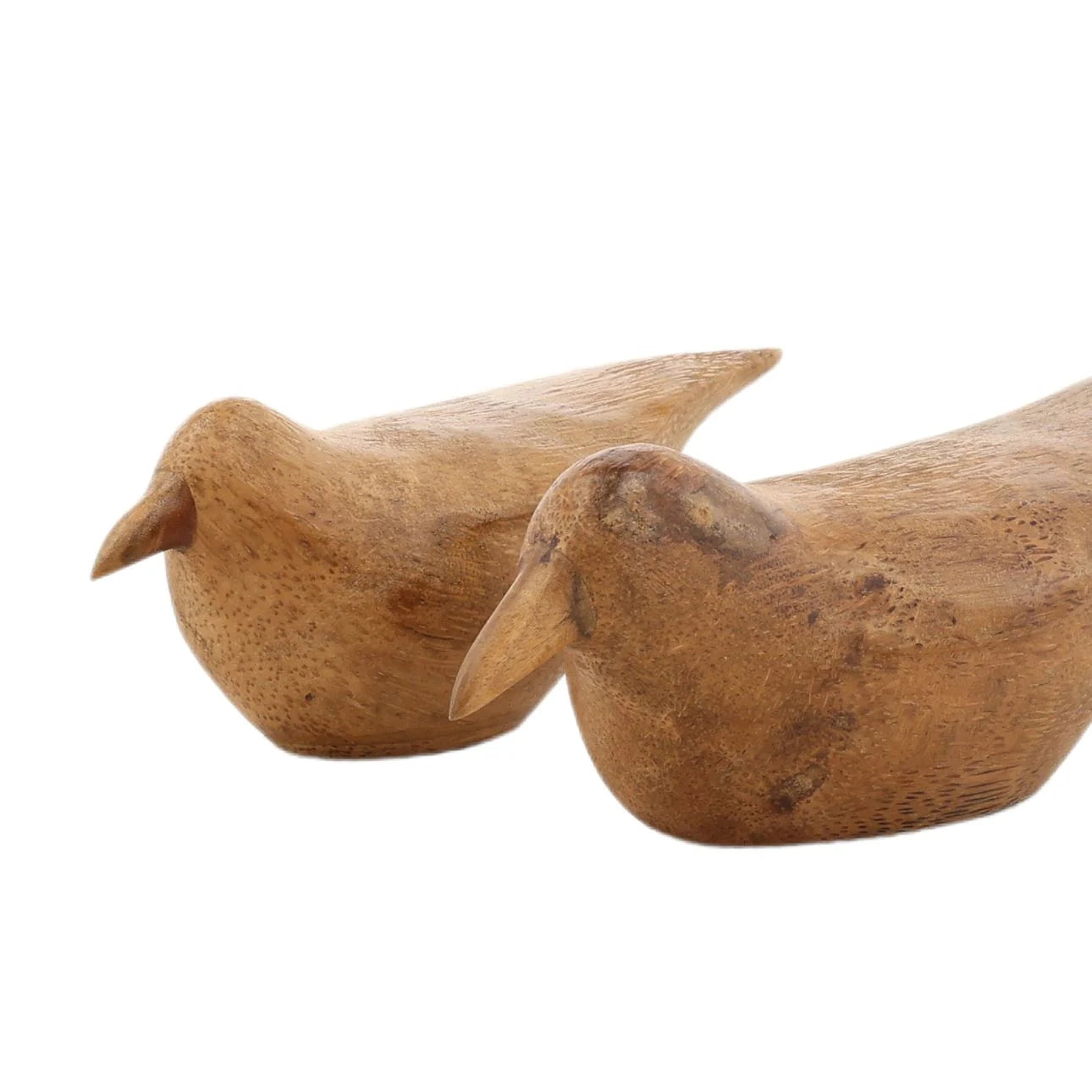 Two wooden bird sculptures on a white background