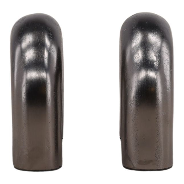 Two metallic cylindrical bookends on a white background