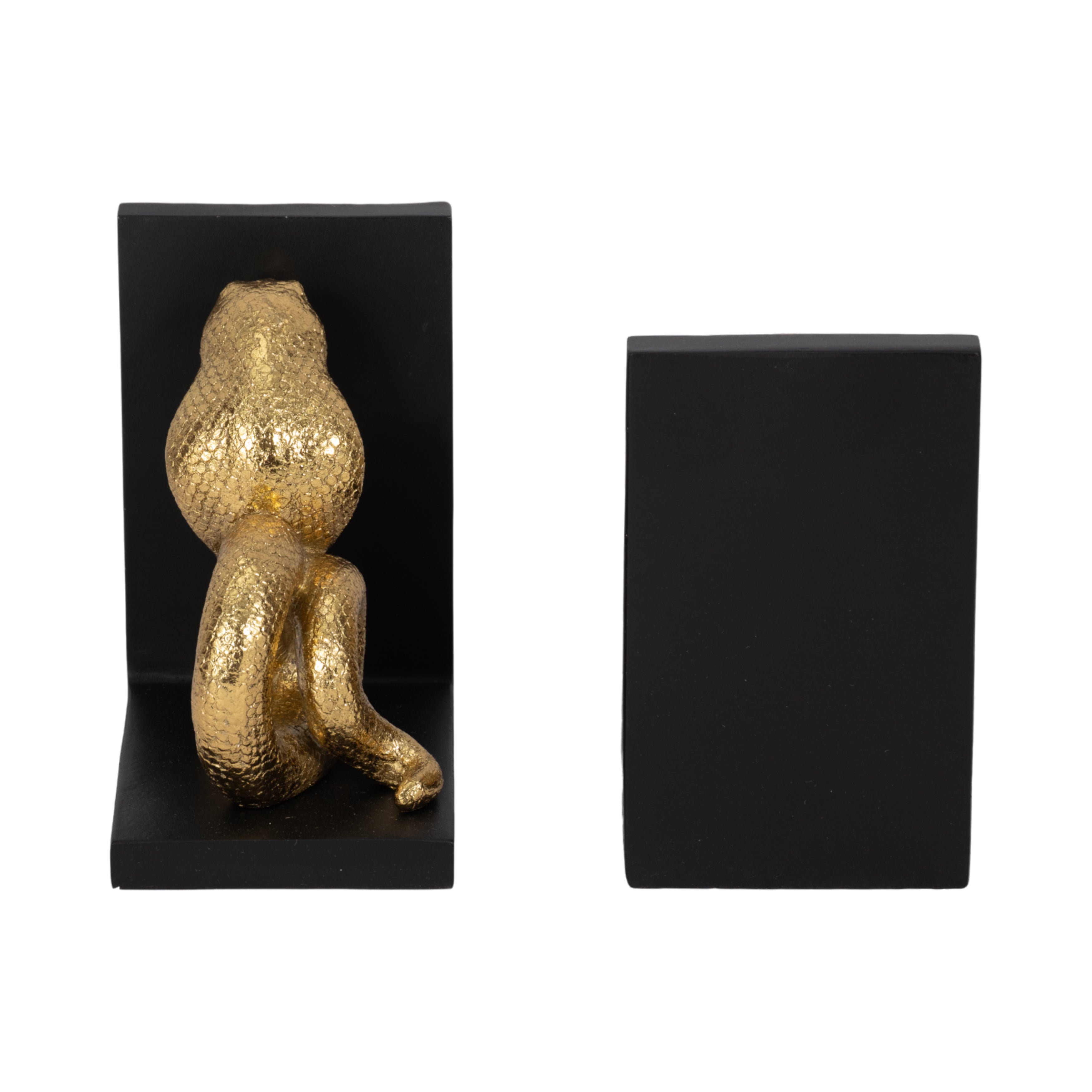 Gold figurine on a black bookend with another black bookend on a white background