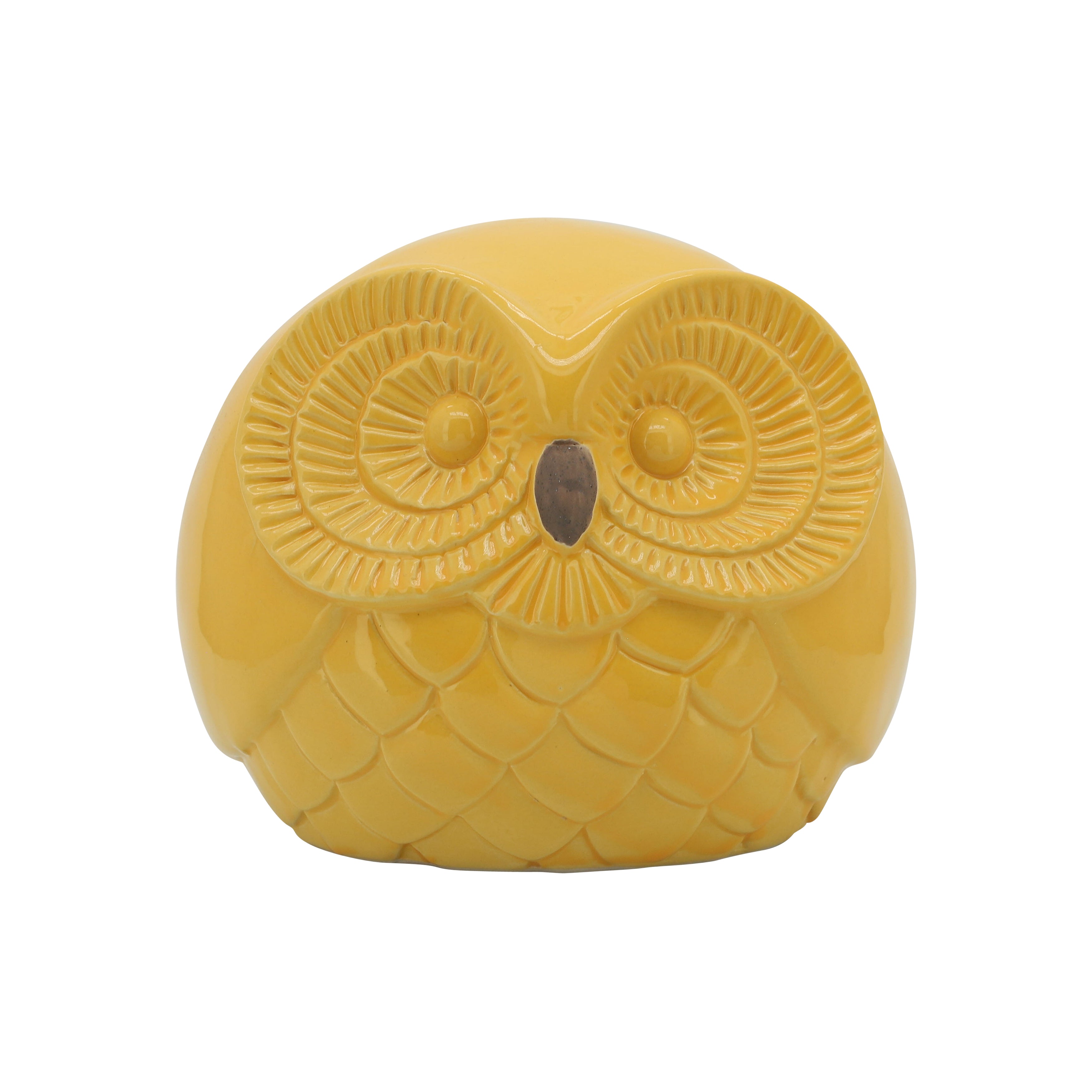 Yellow owl-shaped candle on a white background