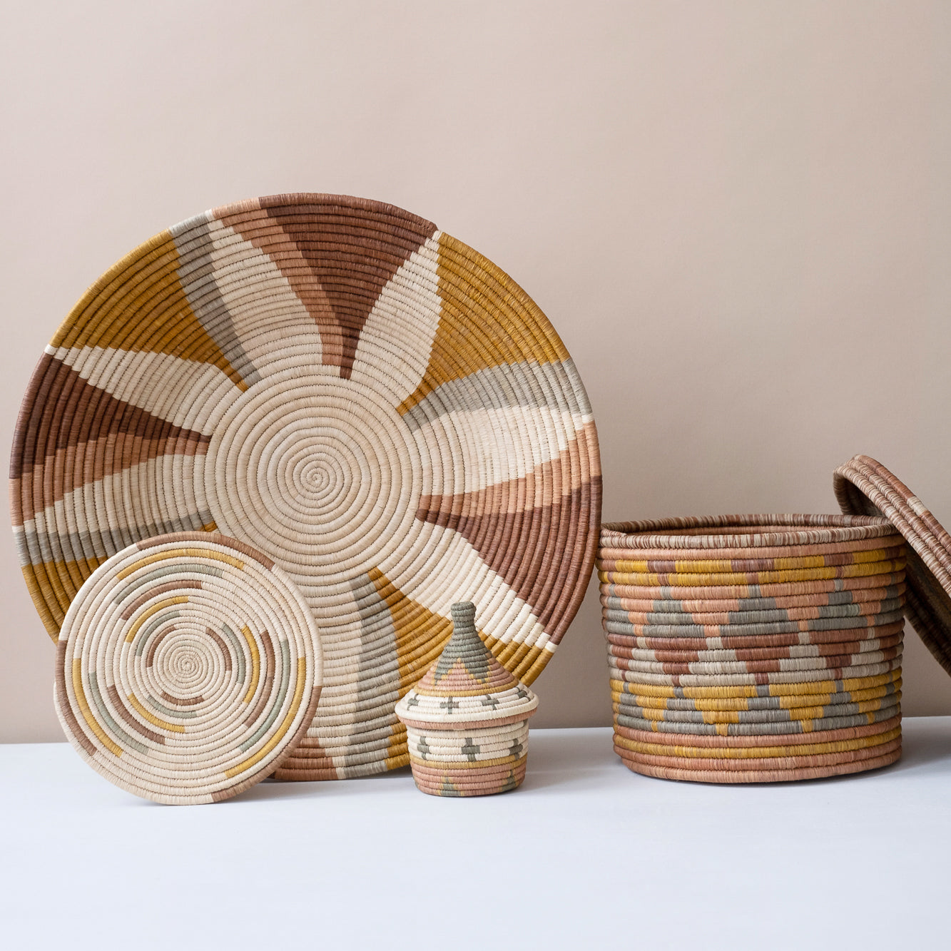 Set of woven baskets with geometric patterns on a neutral background