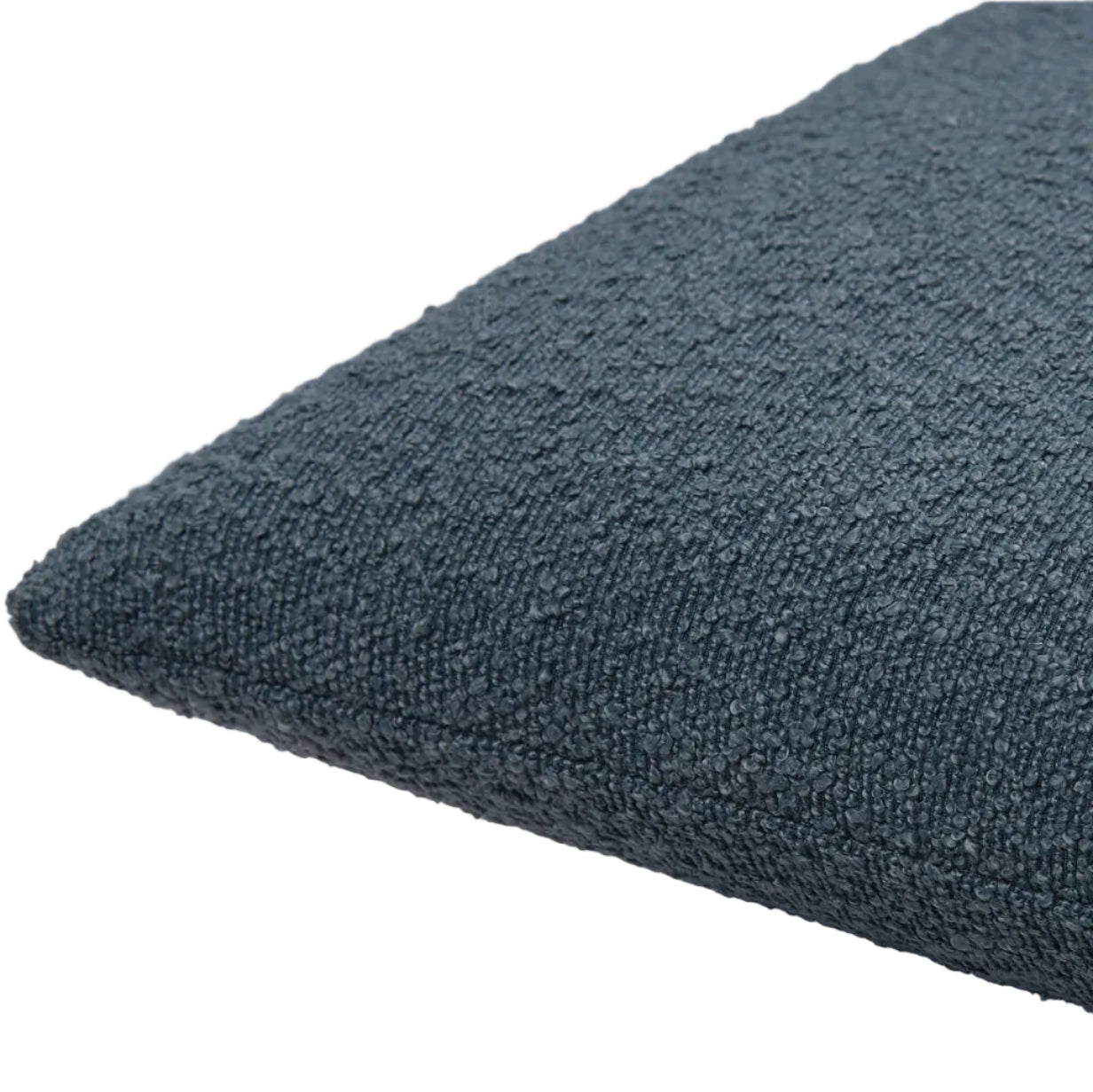 Textured blue cushion on a light gray background