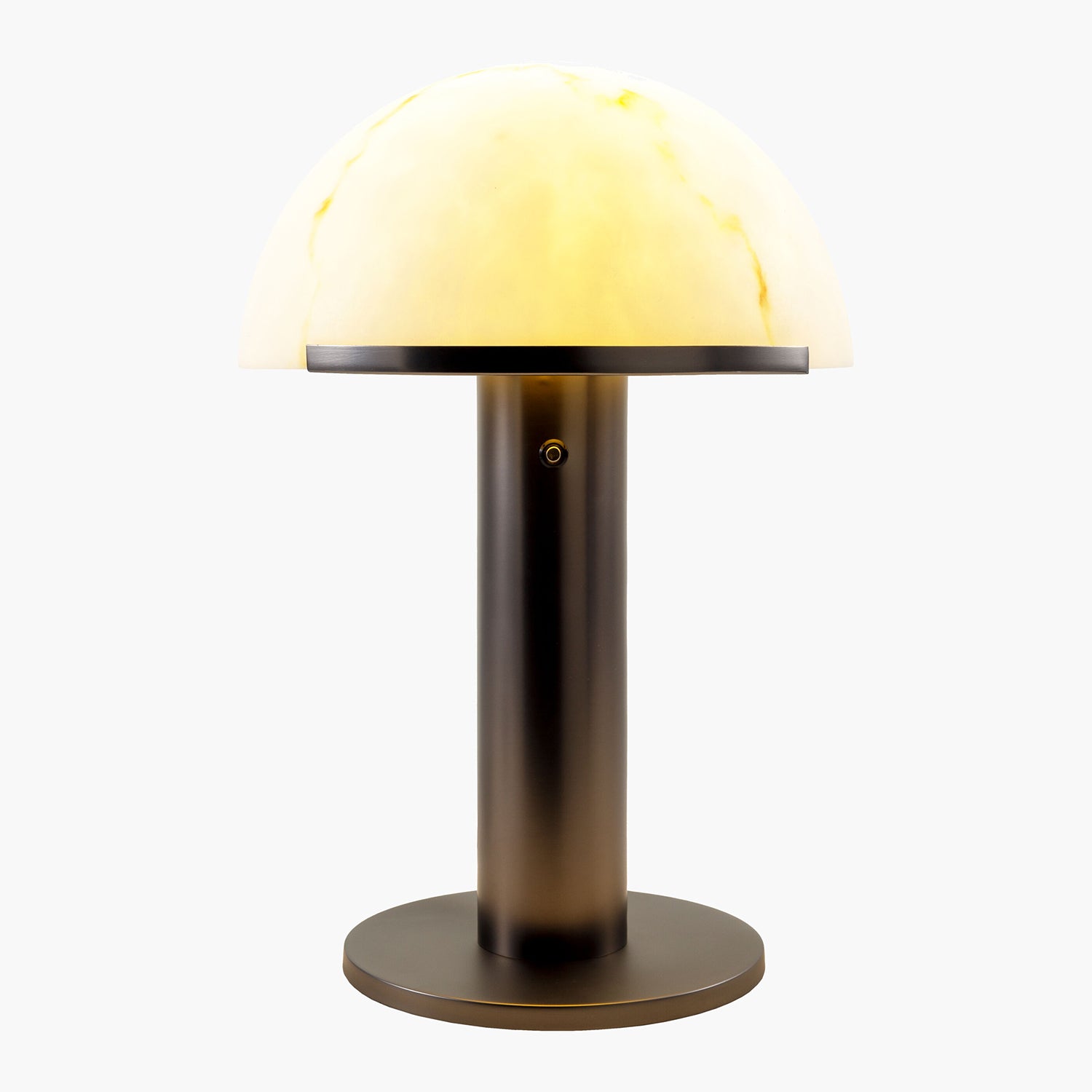 Table lamp with a warm light and glass shade on a white background