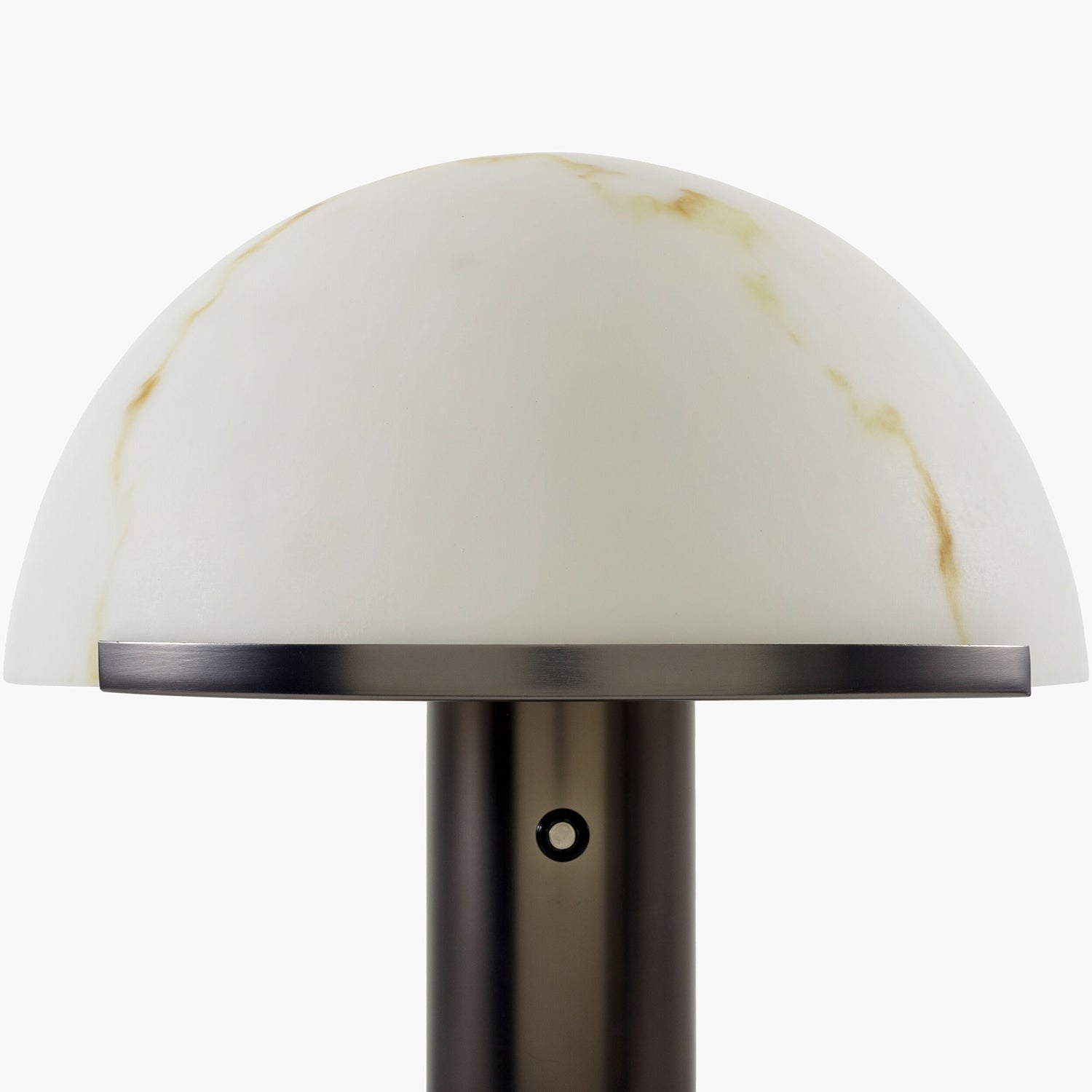 Table lamp with a white marble-like shade on a white background