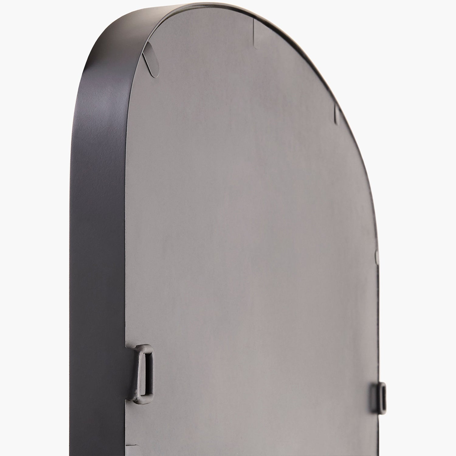 Round metallic object on a white background